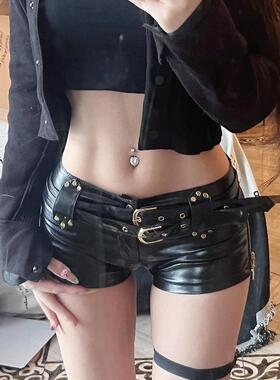 Wearing low waisted, hip hugging leather super shorts,