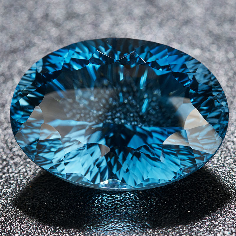 源头捡漏价 25.4克拉蓝色托帕石裸石戒面千禧切工 支持私人定制