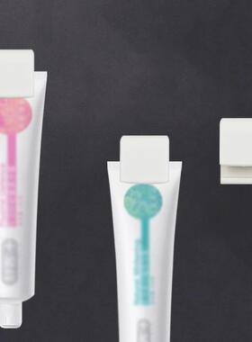 Wall-mounted multifunctional toothpaste holder and facial cl