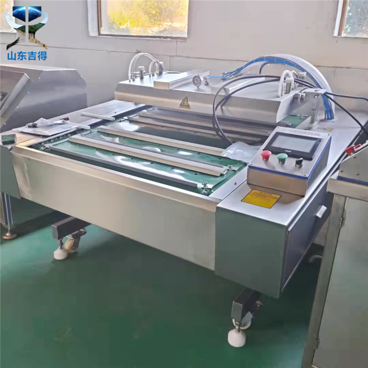 厂家供应鸭翅鸡爪连续滚动真空包装机 鸡蛋干 蛋黄肉粽真空包装机