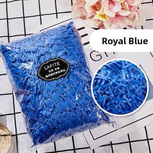 gift lined with shredded paper filling, colored packing box