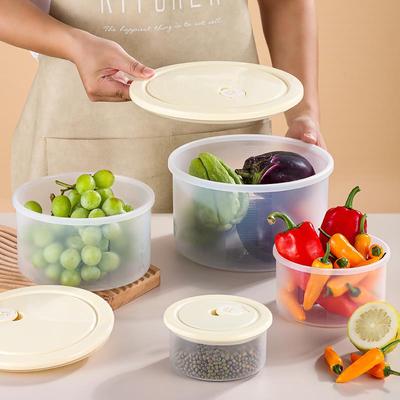 奶油黄食品级塑料保鲜盒可微波炉加热家用带盖圆形碗冰箱收纳盒子