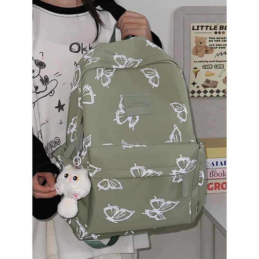 高看反光蝴蝶双肩包款式初中女生高中学生书包大容量旅行双肩包