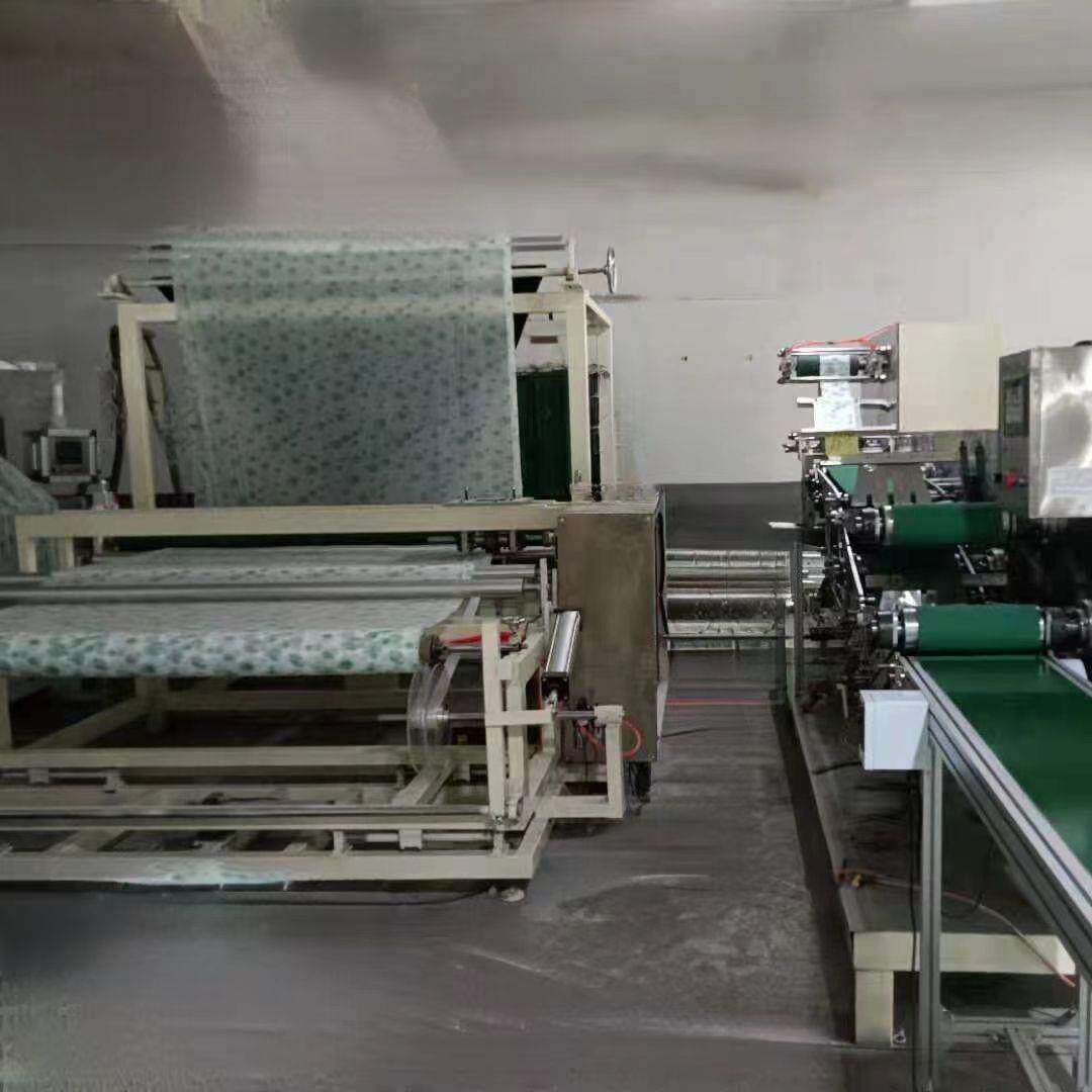 供应一次性床单机设备毛巾浴巾机台布桌布机器厂家