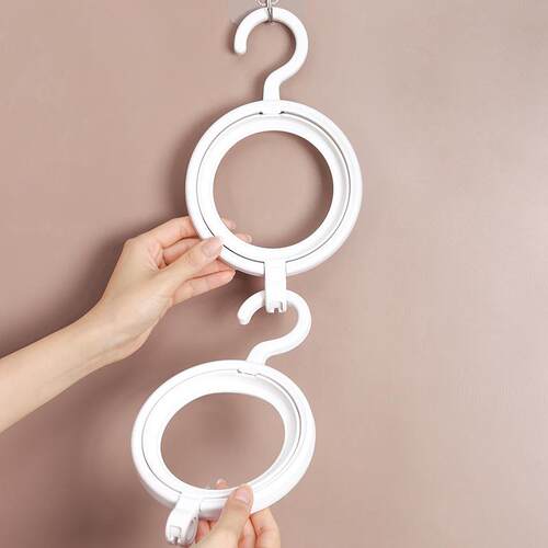 Circular hat, coat, and scarf hanger organizer, a storage wo