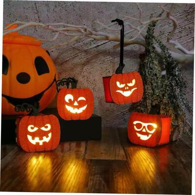 Halloween pumpkins carry small night lights and glow lantern
