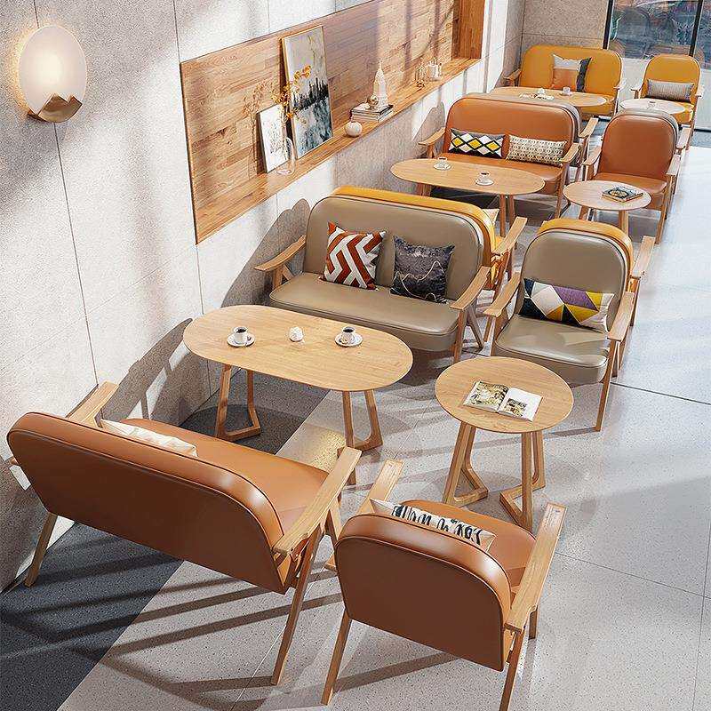 咖啡店洽谈桌椅组合设计师奶茶店实木皮艺椅子甜品店休闲桌椅