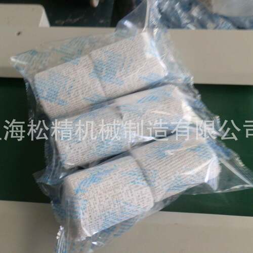 厂家供应湿毛巾口罩包装机木勺子叉子包装设备价格绷带卷封口机