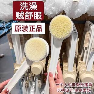 Long-handled bath brush with soft bristles, perfect for scru