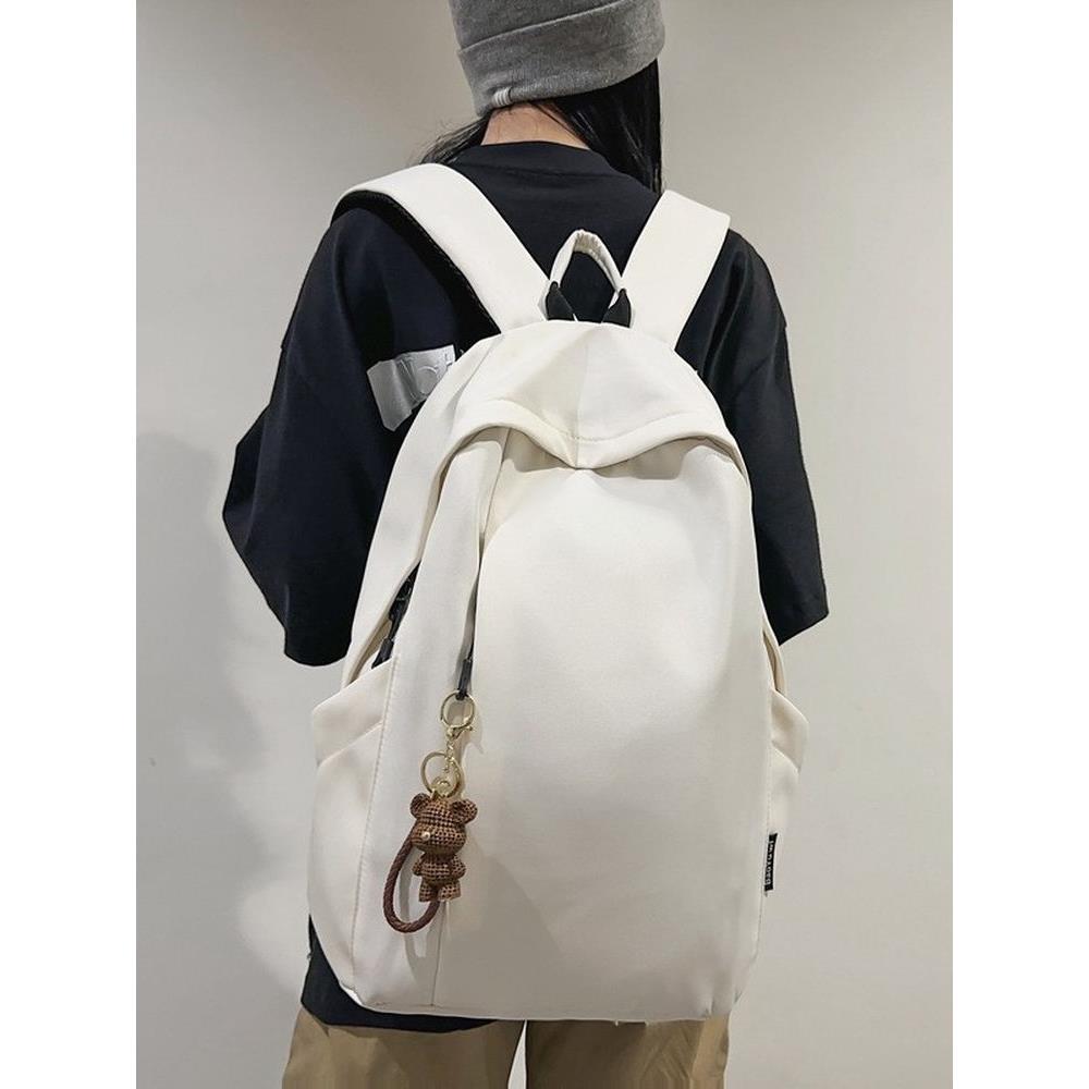 大容量书包男高中大学生韩版潮流旅行背包女初中生简约纯色双肩包