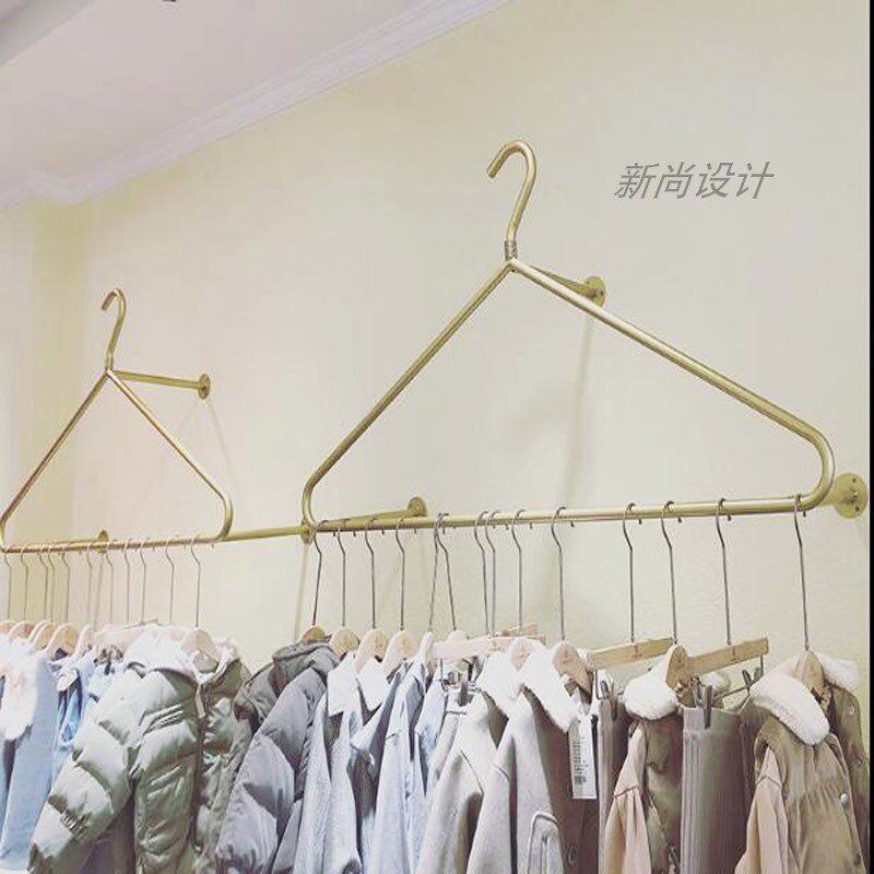 创意简约壁挂式衣架展示架上墙服装架侧挂金色服装架女装童装货架