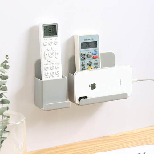 A minimalist wall-mounted remote control storage box, suitab