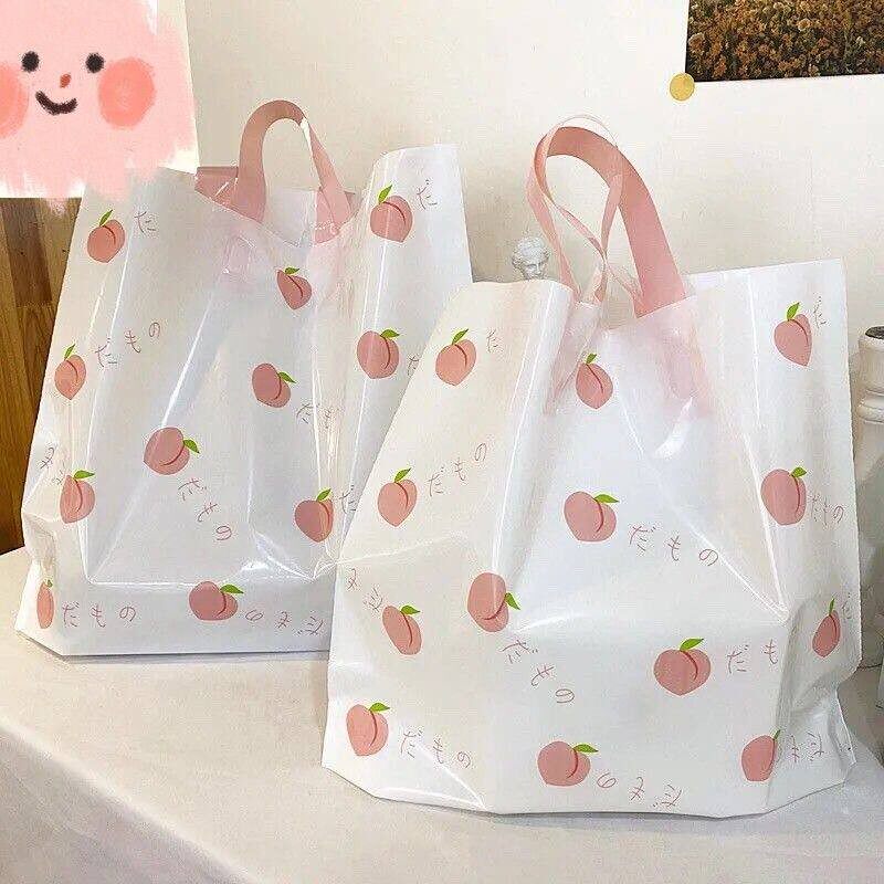 服装店袋子手提塑料袋夏日水蜜桃清新诱惑塑料购物袋化妆品袋包邮