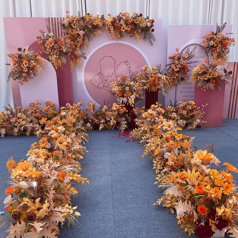 焦糖色婚庆花艺 橘色仿真花婚礼布置排花角花路引花背景t台装饰花