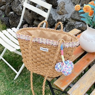 高级感彩色毛球单肩草编包新款花边草包编织包度假沙滩包百搭女包