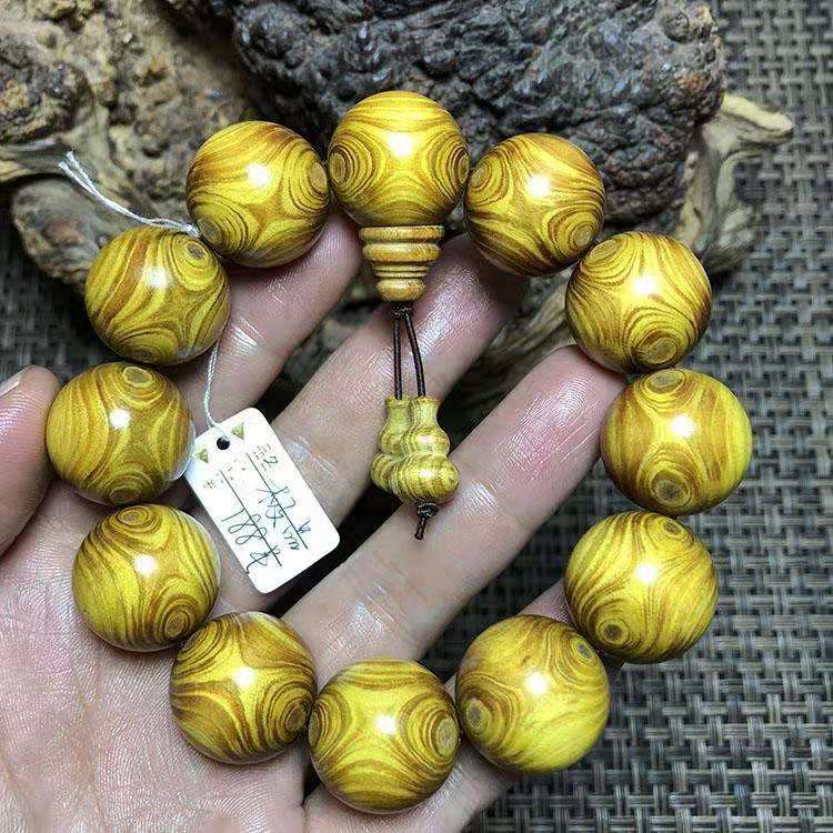 佛珠黄金柚对眼手串男鬼眼手链黄花梨金丝柚楠木文玩黄金木2.