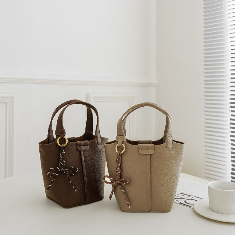 小众设计包包女2024新款时尚简约大容量手提水桶包百搭单肩斜挎包,箱包皮具/热销女包/男包,水桶包,淘宝优惠券,粉丝福利购,淘宝优惠卷