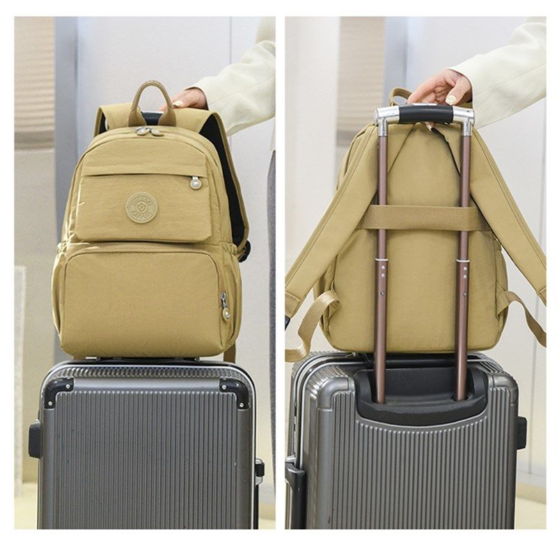 牛津布双肩包女简约多层大容量休闲旅行包百搭防水帆布旅游书包包