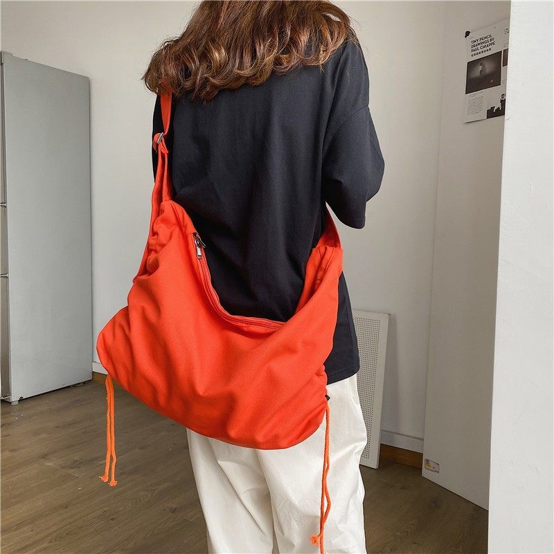 学生书包单肩斜挎包女帆布大容量慵懒风包包小众休闲布袋包男潮