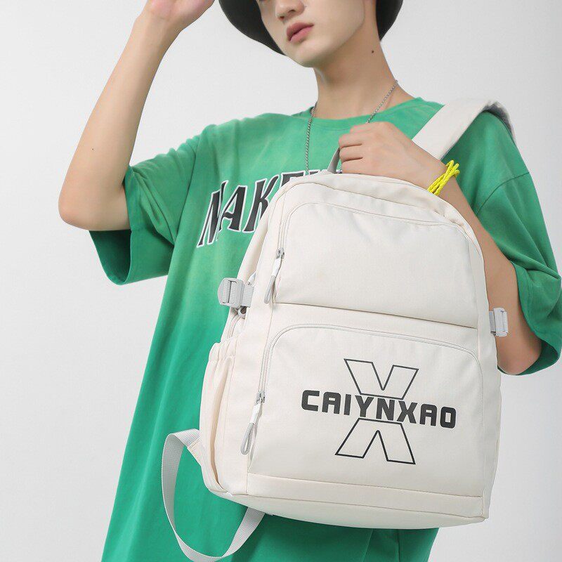 新款轻便男女双肩包男士通勤休闲上班出游旅行揹包中学生书包男生