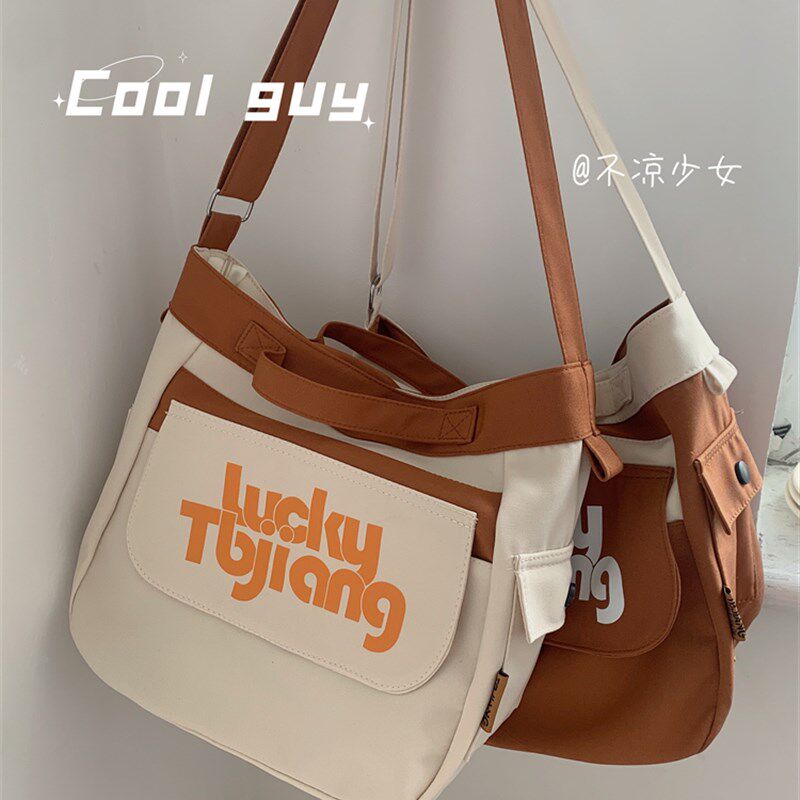不凉少女大容量通勤包日系学生上课斜挎包撞色百搭小众帆布包