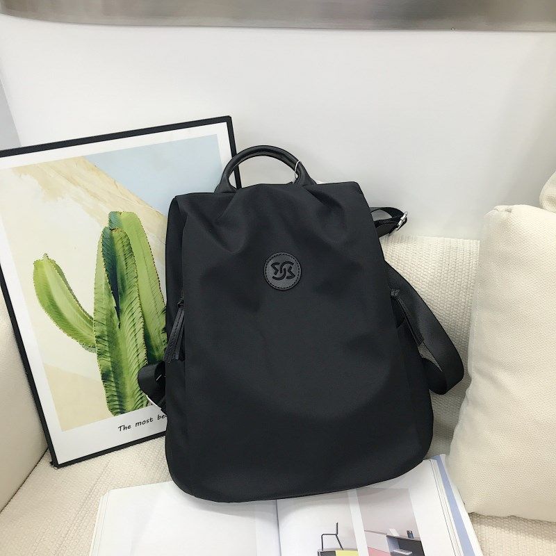 轻便休闲风双肩包包女2024新款牛津布通勤背包背后拉链简约旅行包