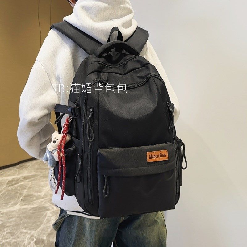 高中生书包2024新款男生潮流黑色双肩包女旅游轻便大容量电脑背包