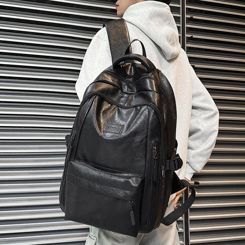 潮酷PU皮质感双肩包男大学生书包户外通勤短途旅行防水背包女个性