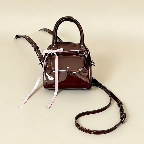 HIATUS巧克力色漆皮蝴蝶结双肩包