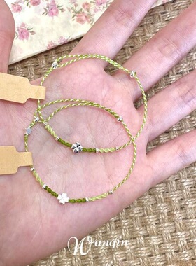 小红书爆款绿色四叶草小蝶蜡线编织手链女时尚显白设计百搭奢品一