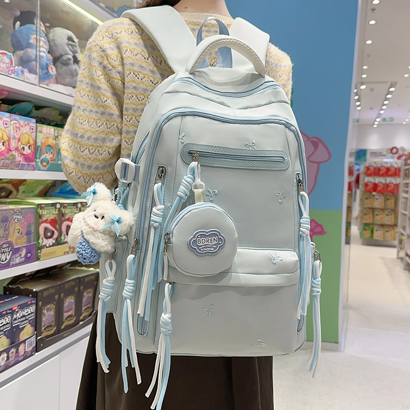 书包女生初中生韩版高颜值蝴蝶结背包高中小学生减负学院风双肩包