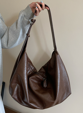 软皮大容量黑色饺子包包女2025新款复古通勤休闲单肩斜挎托特包