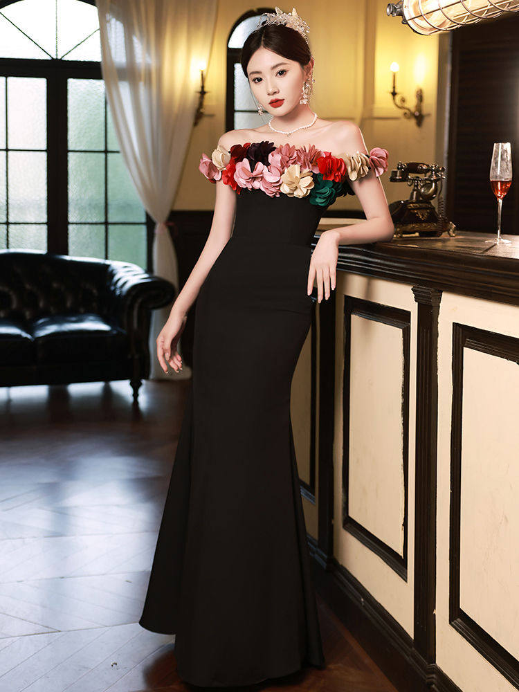 黑色年会晚礼服2024新款一字肩高端气质名媛主持人鱼尾裙高级感女