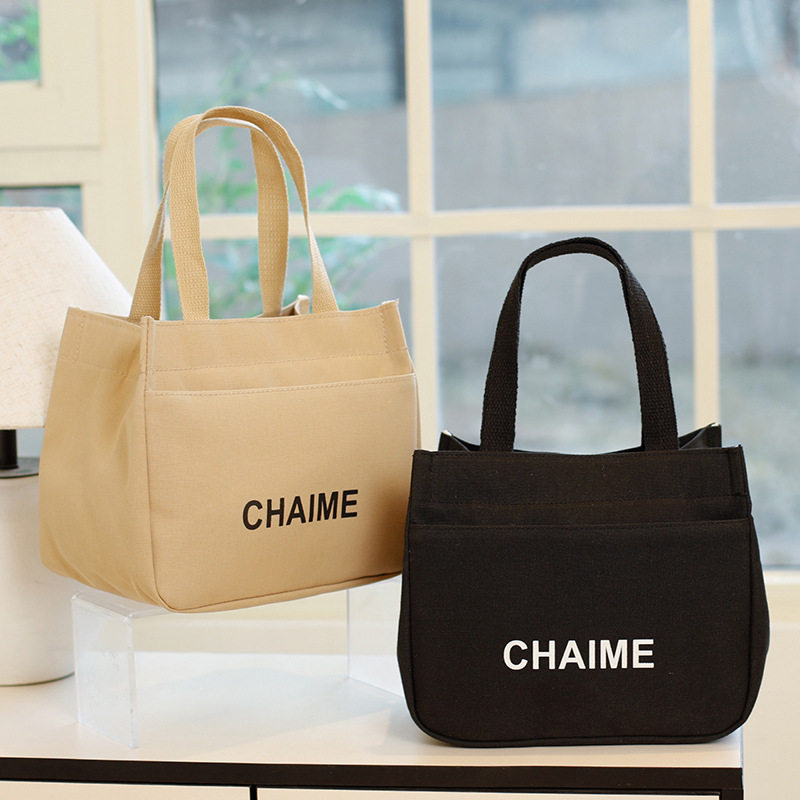 帆布手提包2025时尚双拉链便携纯色印花妈咪包大容量上班族便当包