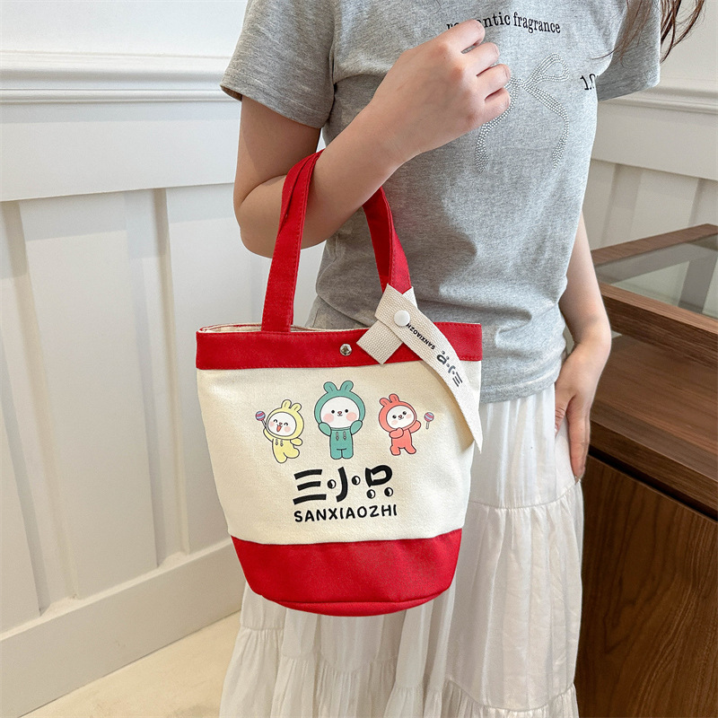 新款卡通印花水桶包潮流时尚帆布手提包大容量单肩包便当包