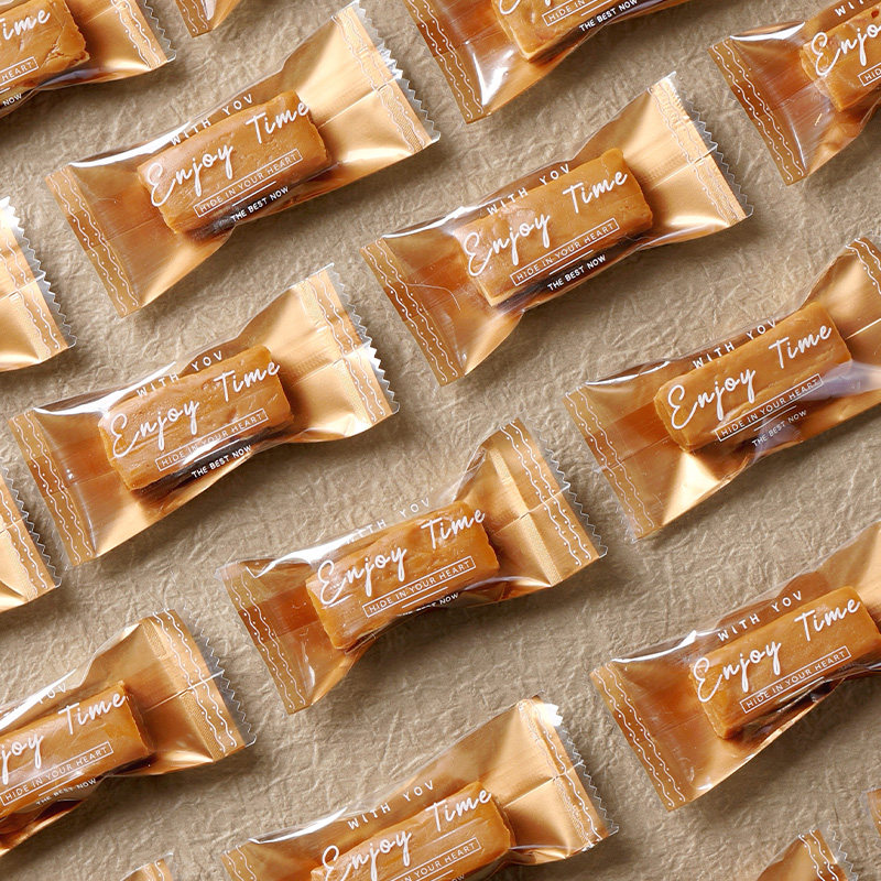 2026太妃糖包装袋过年高档金色英文牛轧海盐杏仁咖啡糖机封加厚袋