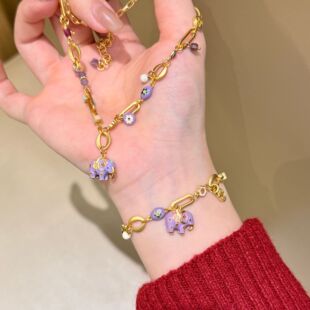 深圳旭佳旭家新中式国风元素滴釉吉象吊坠金色不规则项链女高级感