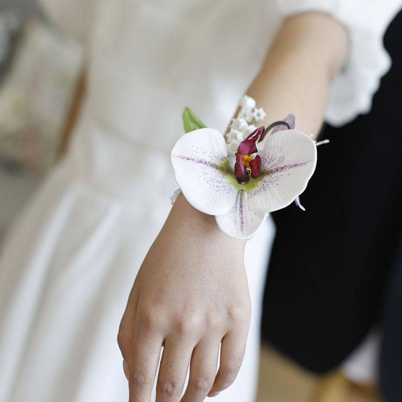 仿真蝴蝶兰新娘伴娘婚礼手腕花新郎伴郎父亲母亲会议商务活动胸花