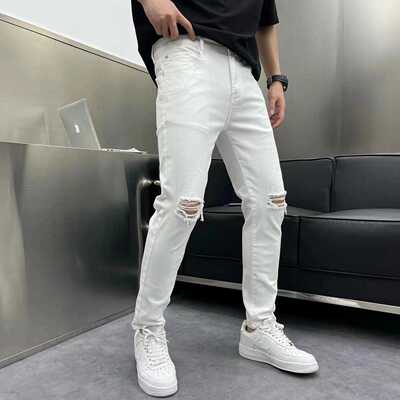 白色破洞水洗修身小脚牛仔长裤