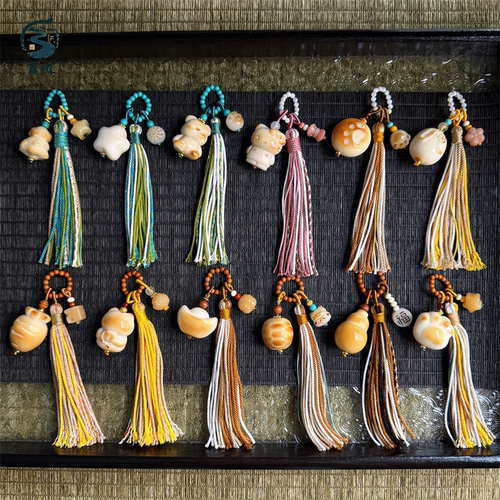 手工编织象牙果小熊屁桃流苏隔珠