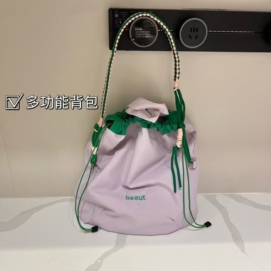 新款小众抽绳束口袋手提单肩包