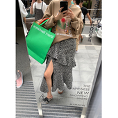 落落狷介显瘦碎花半身裙春秋女2026秋款 不规则荷叶边下摆开叉半裙