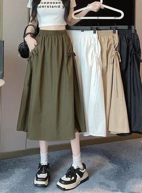 2026年夏季流行新款百搭纯色系带抽绳口袋中长款工装半身a字裙女