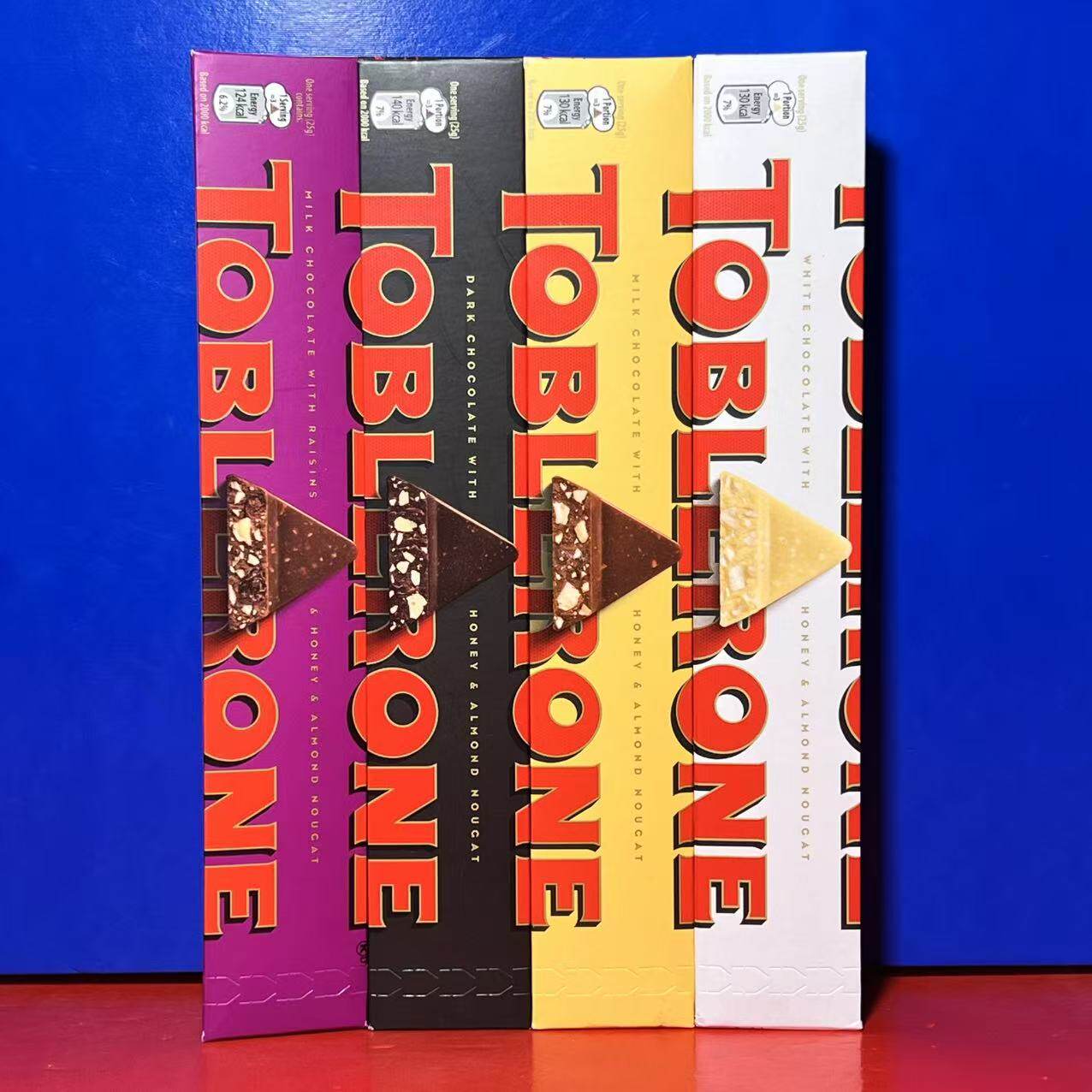 瑞士三角牛奶巧克力100克黑巧白巧葡萄巧休闲零食糖果临期特价