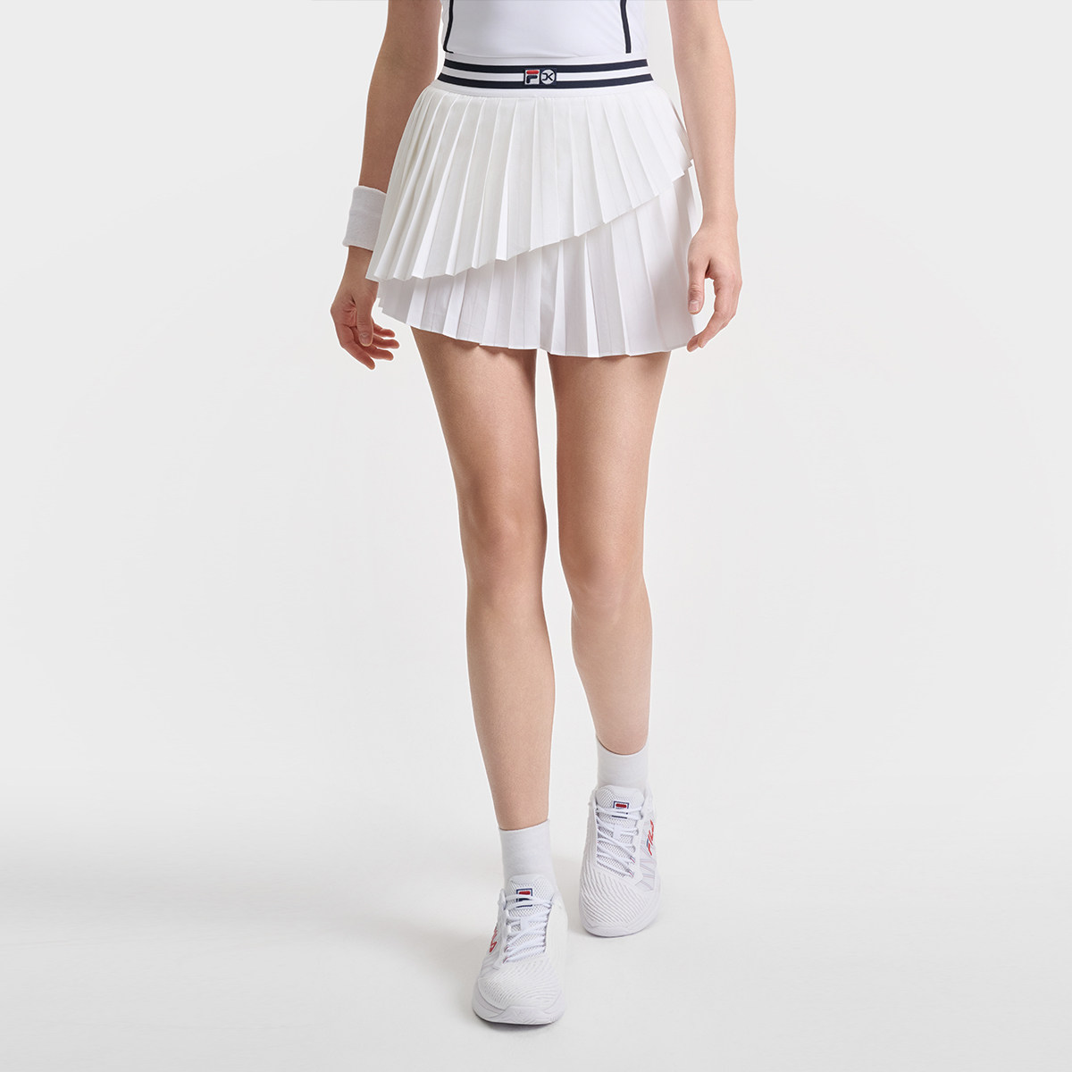 Fila/斐乐秋季新款女子户外时尚休闲场下网球半身裙A11W523322F