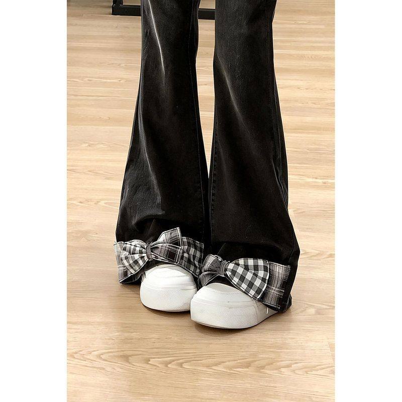 自然涩立体蝴蝶结微喇叭牛仔裤女春季新款黑色显瘦百搭阔腿裤子