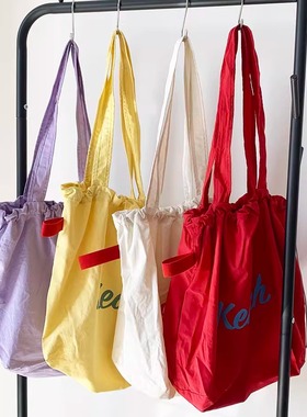 韩版新款字母印花包包女大容量尼龙单肩包休闲百搭便携抽绳托特包