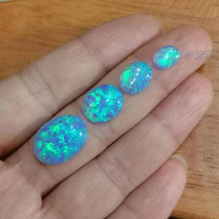 新型合成蓝色欧泊蛋白石澳宝戒面 变彩漂亮透明度仿真度高 可定制