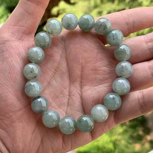 缅甸翡翠浅绿底乌鸡飘花手串12mm