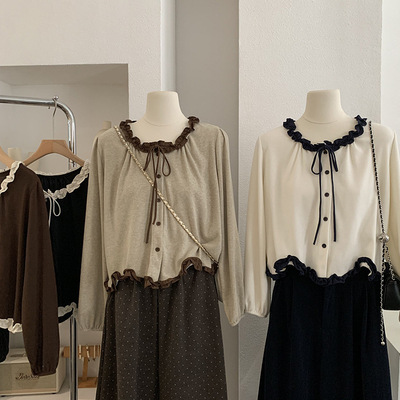 欧玛莱 木耳边不规则波浪下摆蝴蝶结系带长袖上衣甜美温柔风